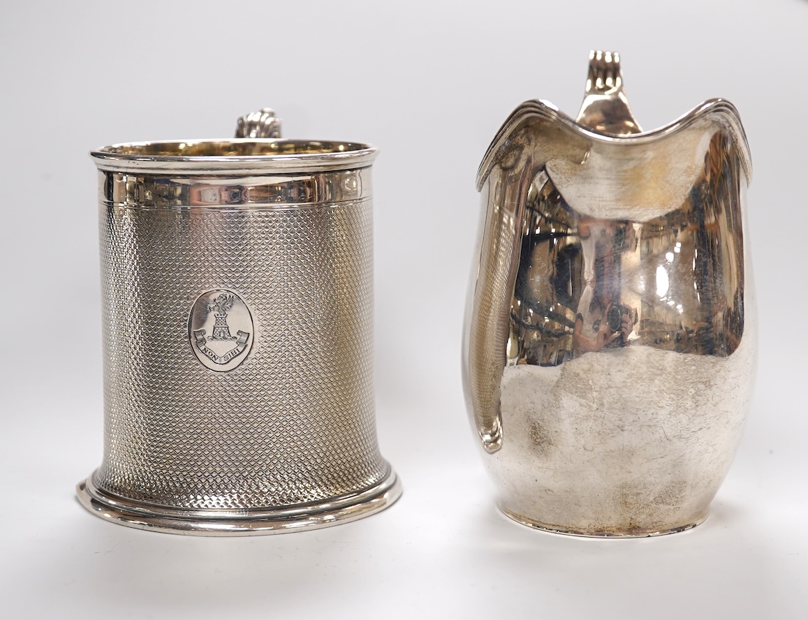 A Victorian engine turned silver christening mug by John Samuel Hunt (Hunt & Roskell), London, 1863, with later engraved inscription to the base, height 89mm, together with a George VI silver cream jug, London, 1947, 12o